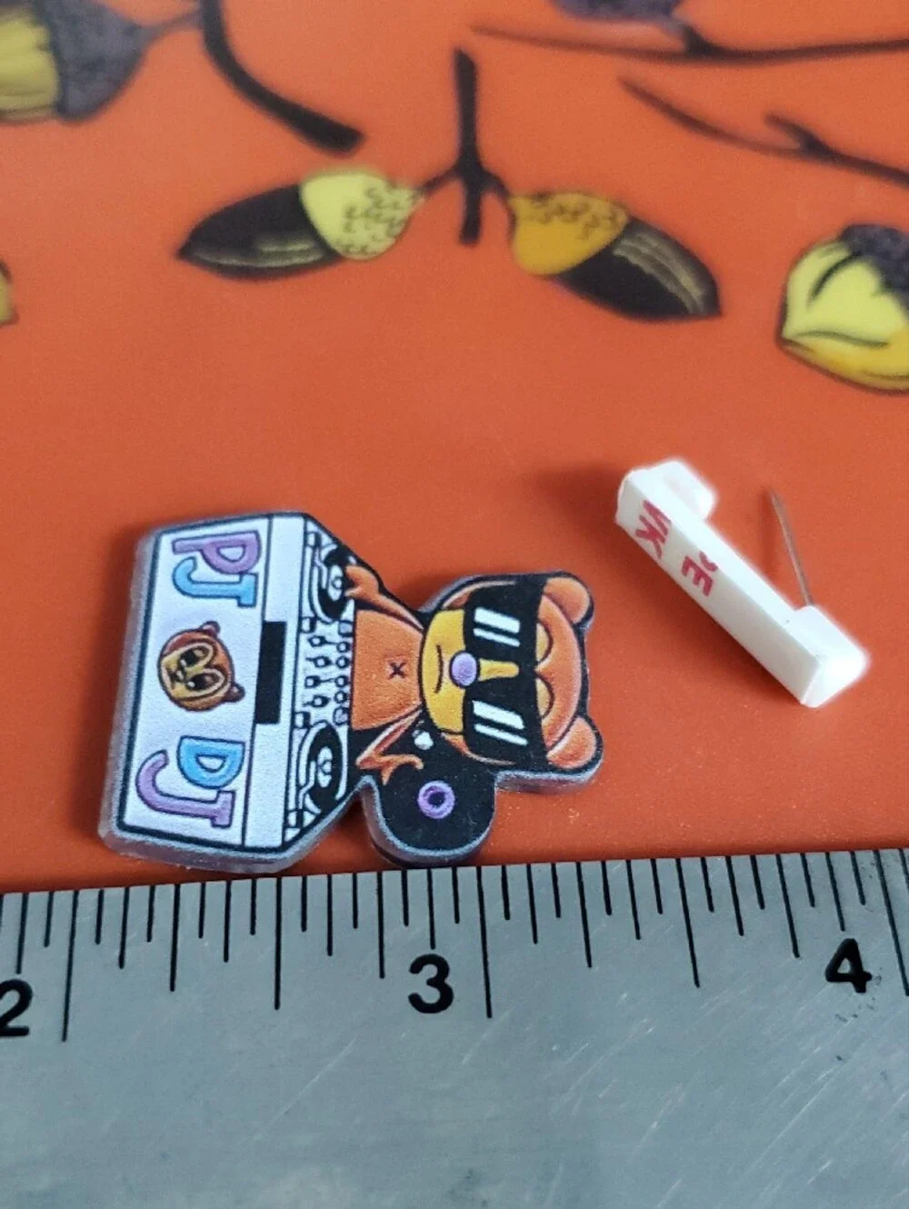 PJ Berri DJ Bear Acrylic Pin in Orange, Black & White